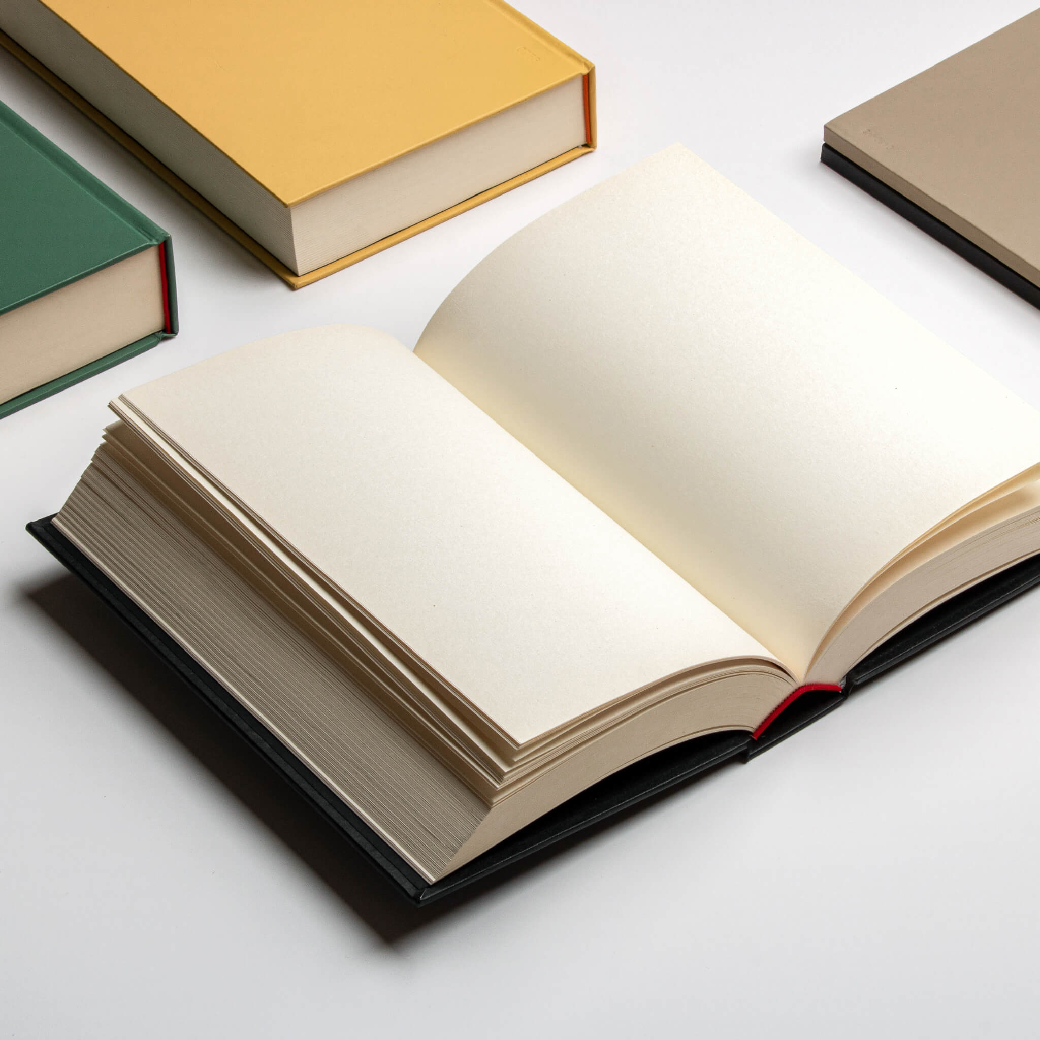 Open basenotes 0256 Notebook with a black hardcover, showing thick pages and lay-flat design on a white background.