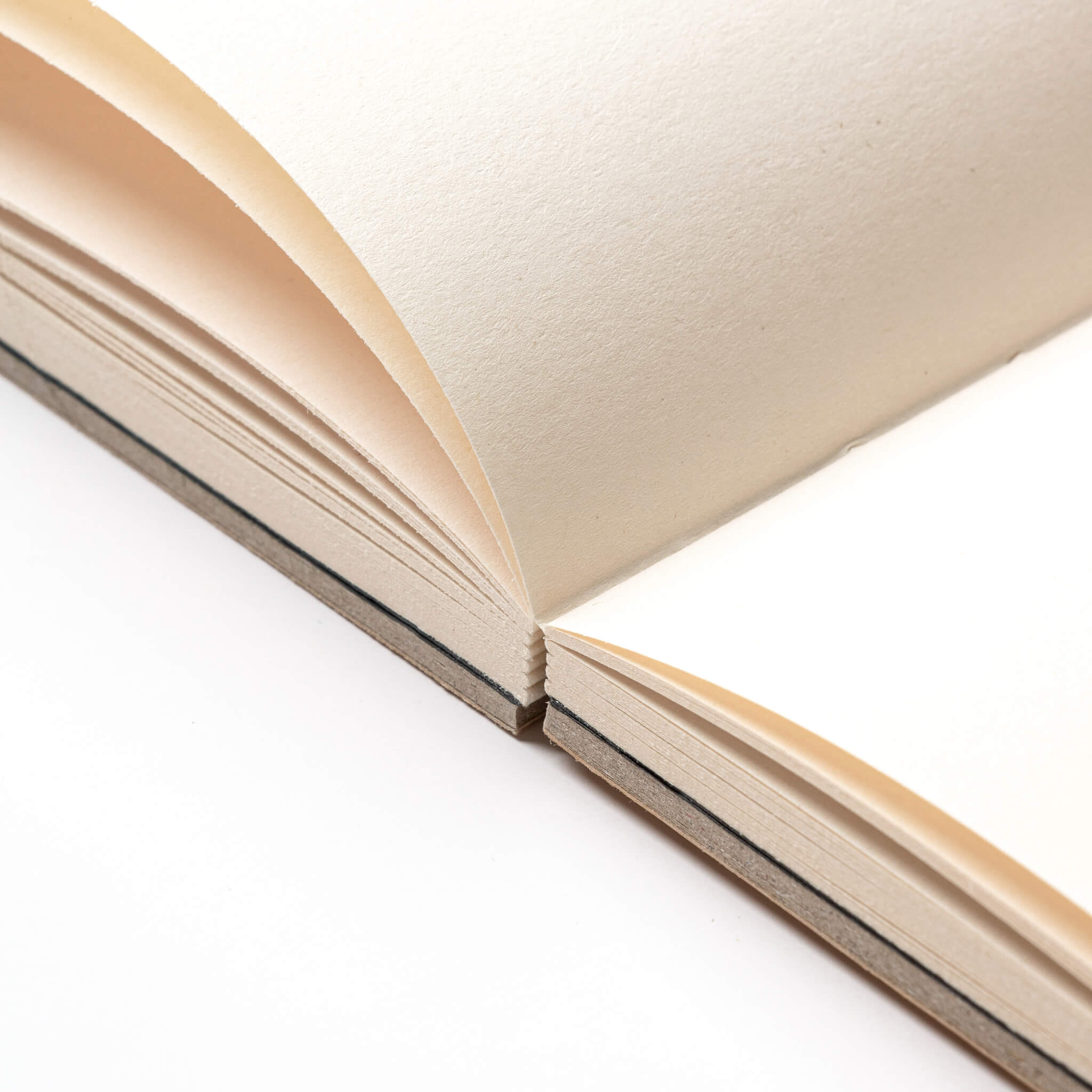 Close-up of the basenotes 0880 Notebook’s lay-flat binding showing clean stitching and sturdy construction.