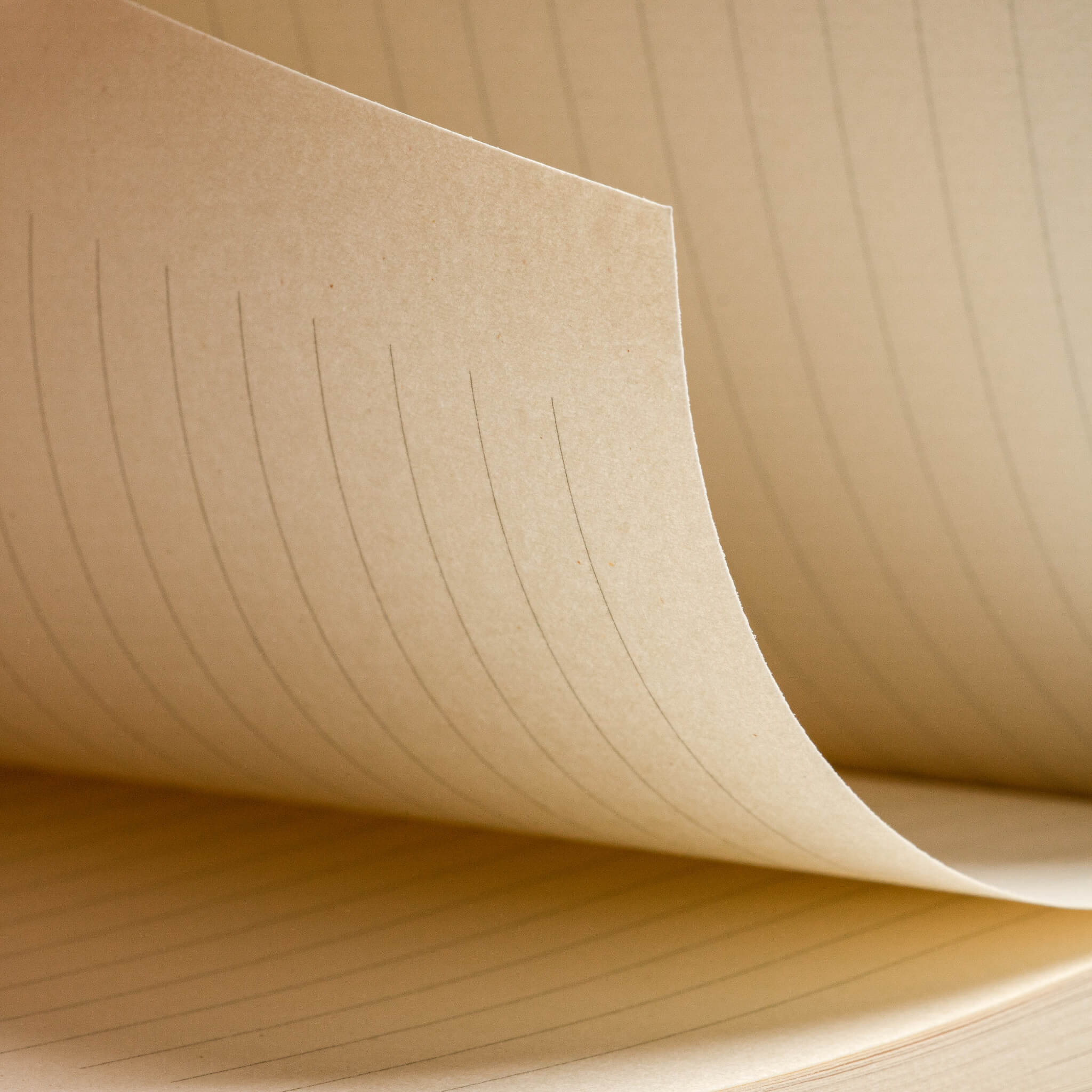 Close-up of basenotes 0960 Notebook lined page, revealing its warm-toned, acid-free writing surface.