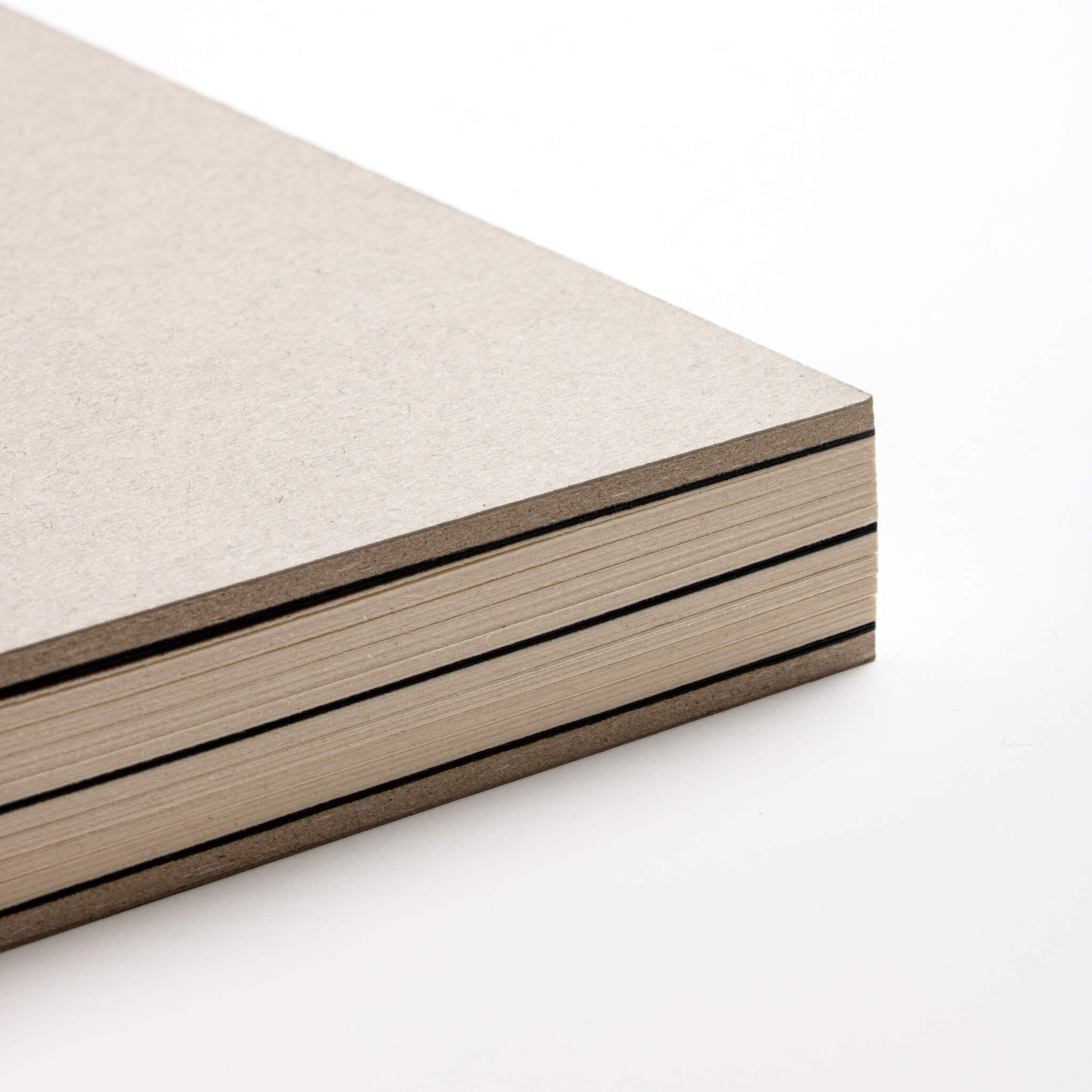 Close-up of the basenotes 1623 Paperbook in beige with eco-friendly hand-stitched binding and FSC-certified paper.