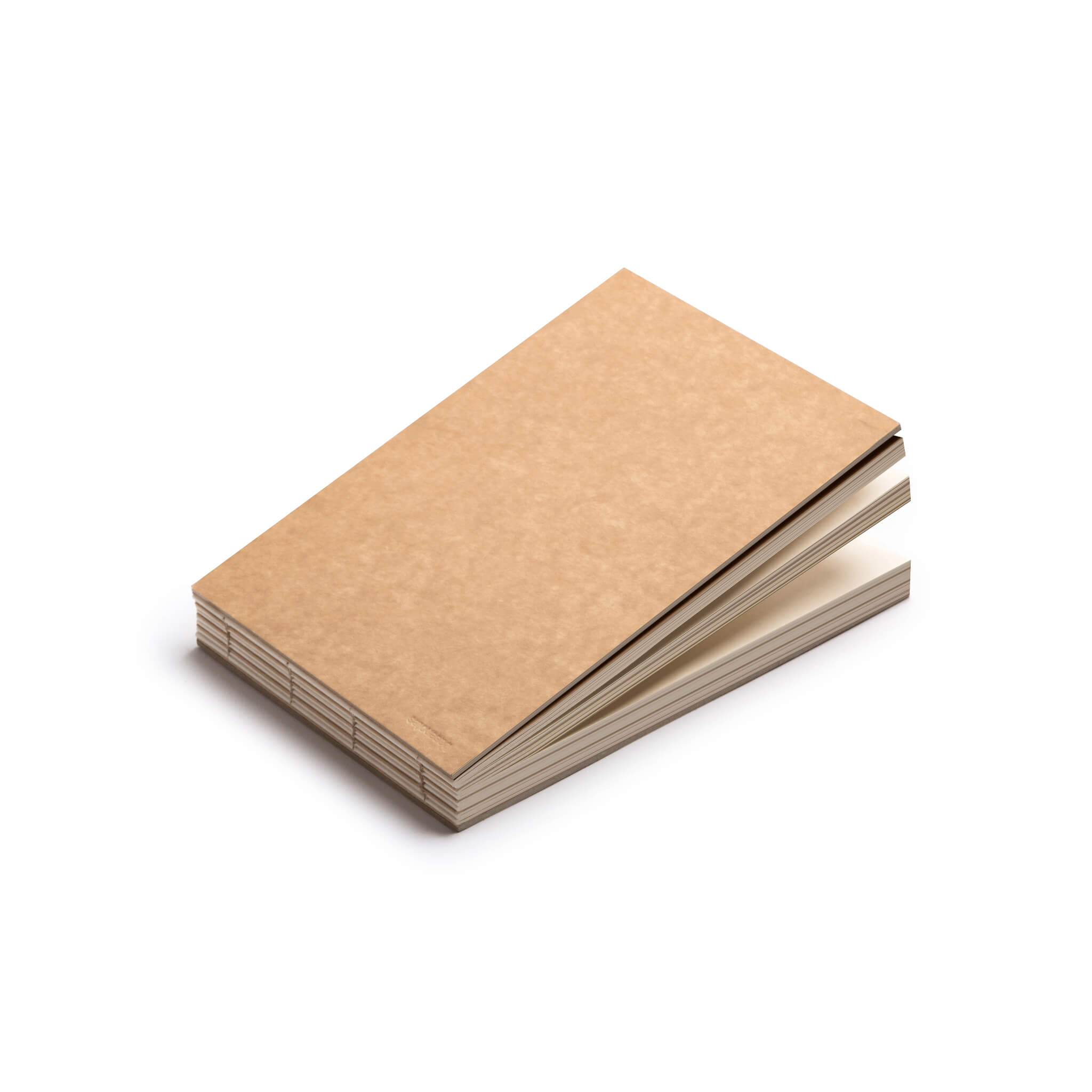 basenotes 2316 kraft sketchbook showing layered paper edges and exposed stitching.