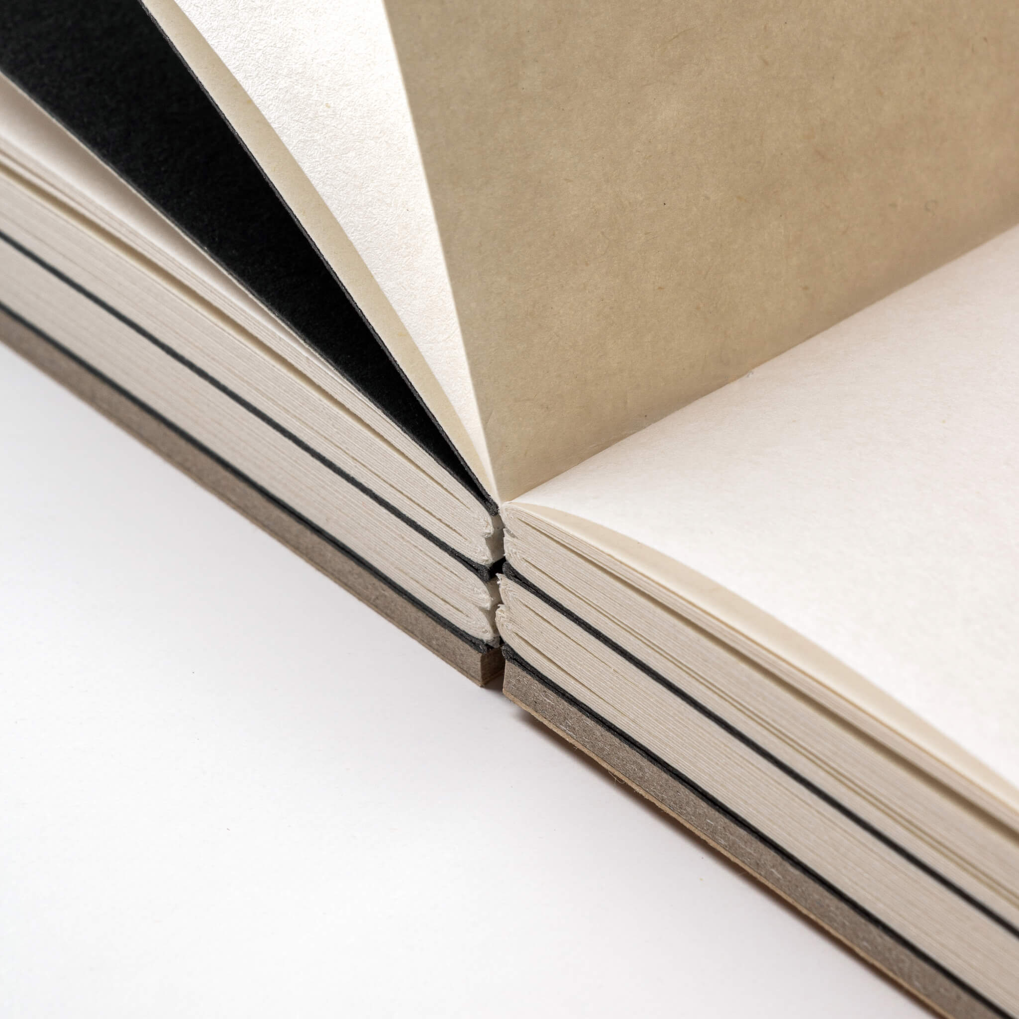 Close-up of the basenotes 2333 Paperbook showing section dividers, black inserts, and precise thread binding.