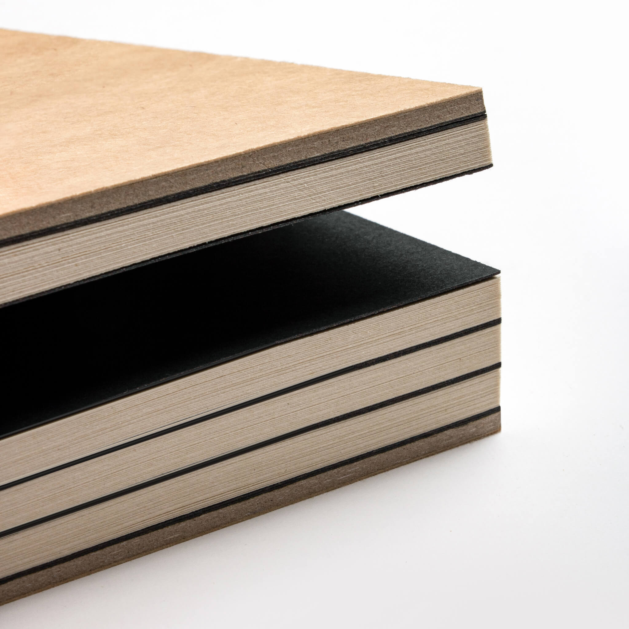 basenotes 2333 Paperbook showing alternating black dividers and natural cream pages with visible hand-stitched binding.