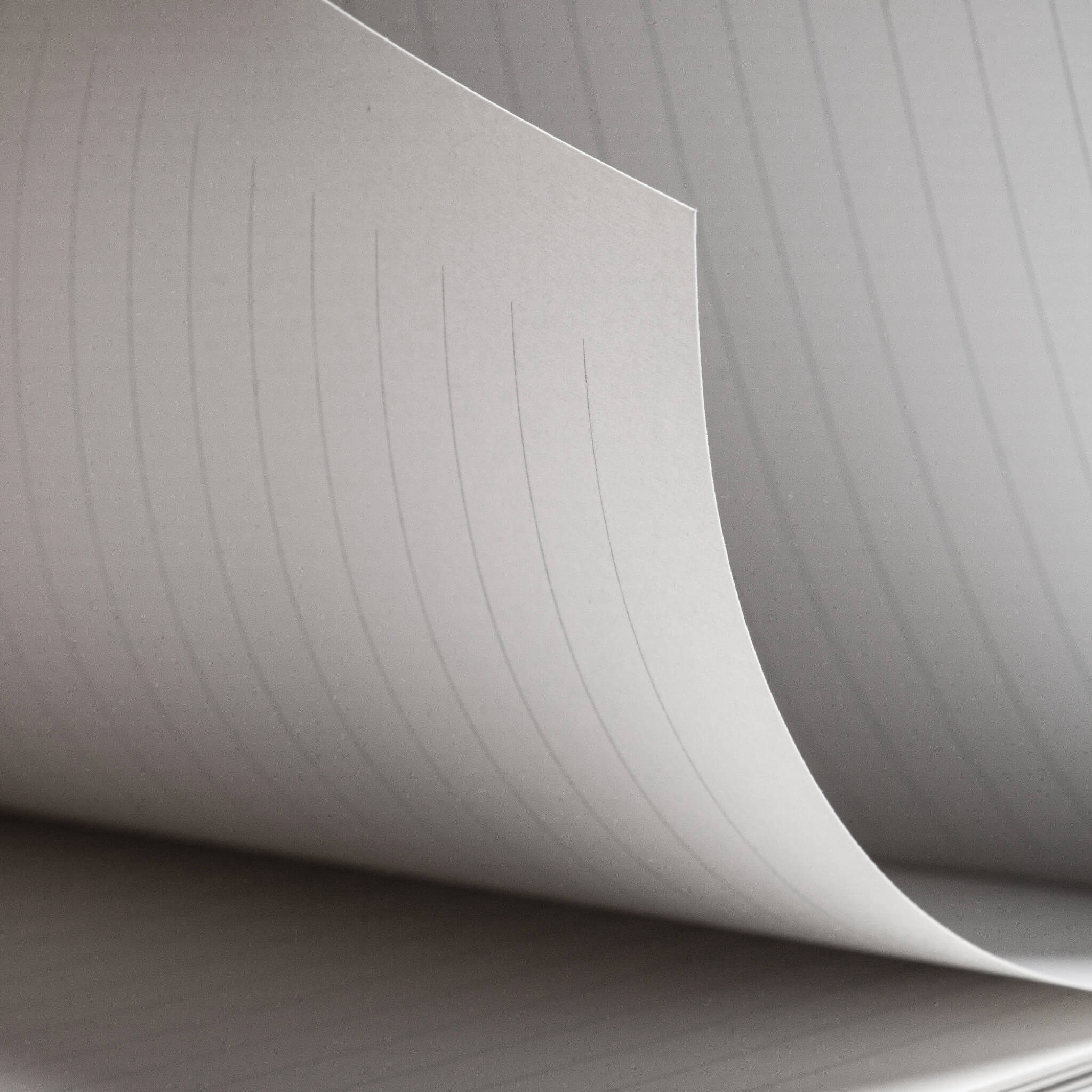 Close-up of basenotes 4000 A5 Notebook’s lined paper showing even spacing and fine texture suitable for pen and rollerball use.