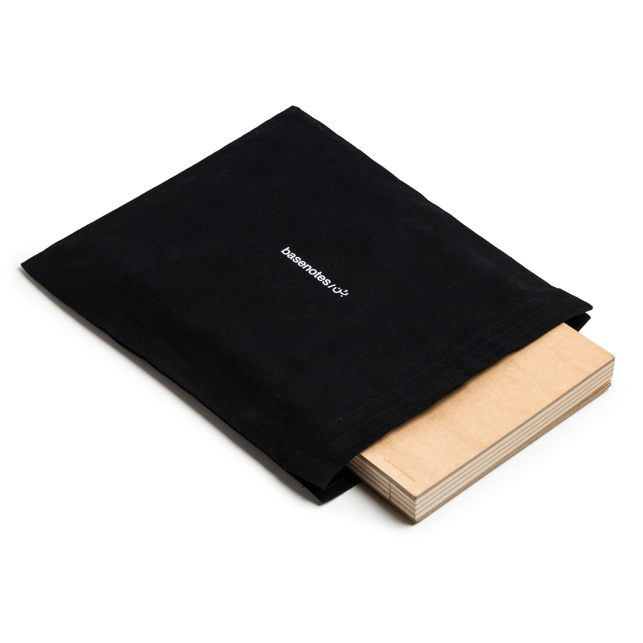 basenotes A4 black fabric notebook cover with notebook inside, shown in a clean flat lay