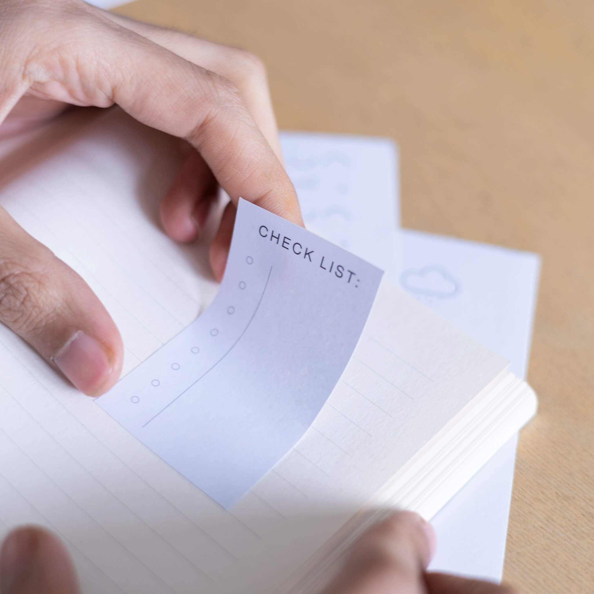 Checklist basenotes planner sticker applied to a lined notebook page for task tracking and planning.