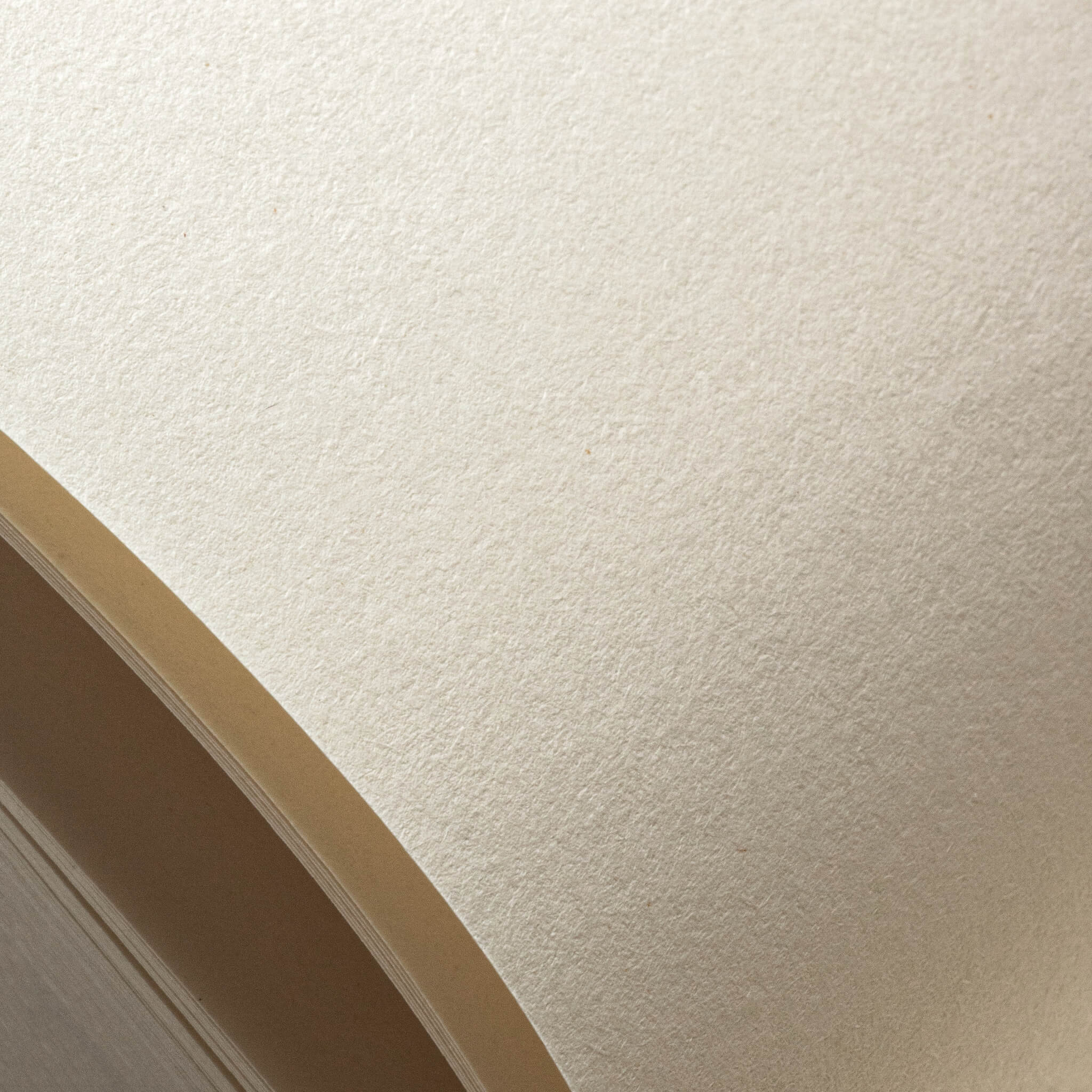 Macro detail of the basenotes 0512 Notebook’s bulky FSC-certified paper, showing its natural, uncoated texture and soft ivory tone ideal for writing or sketching.