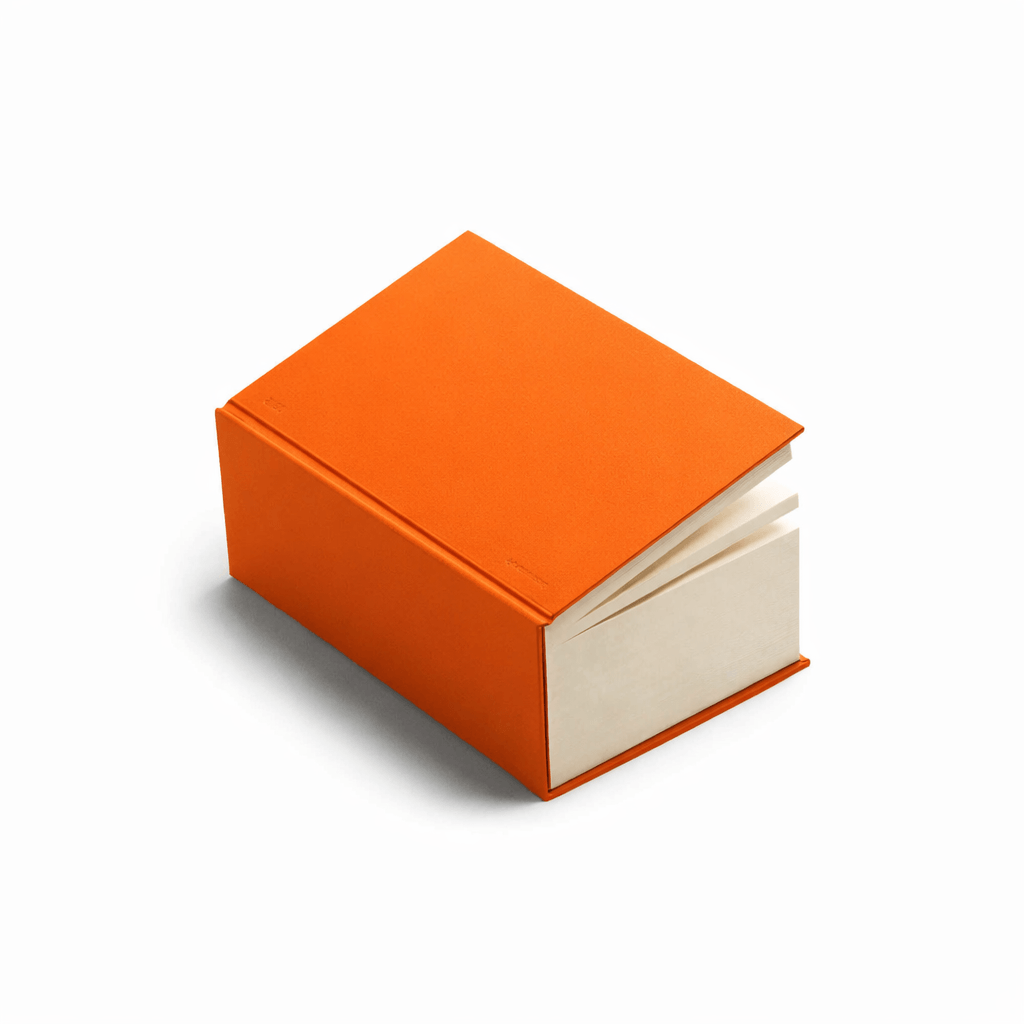 basenotes 0512 notebook in bold Orange hardcover with a hand-stitched spine. Features 1024 pages of FSC-certified bulky paper, perfect for daily notes and ideas.