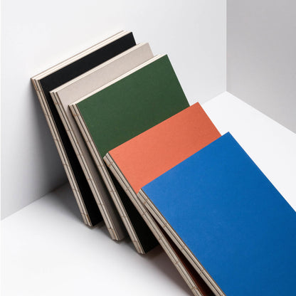 basenotes 1623 Paperbook collection in Clay Rust, Green, Beige, Blue, and Black eco-friendly covers.