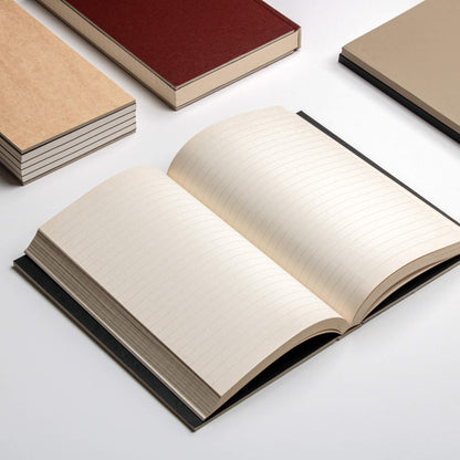 Open basenotes 0128 Notebook surrounded by other notebooks on a minimal white surface, displaying lined acid-free pages.