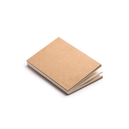 Kraft basenotes 0880 Notebook in a minimalist setup, showing smooth cover texture and visible stitching.