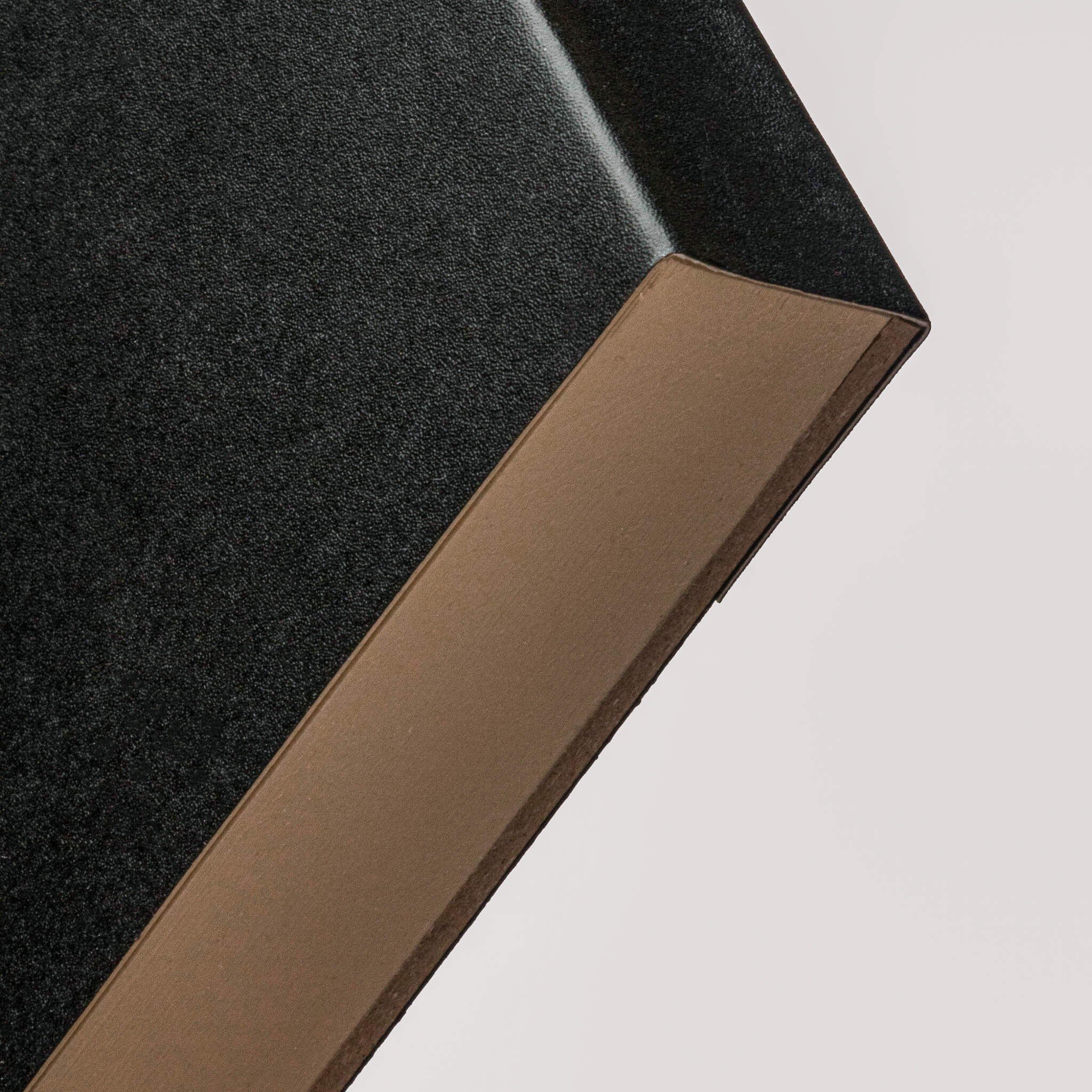 Close-up of the basenotes 0960 Notebook black cover corner, highlighting the matte textured surface.