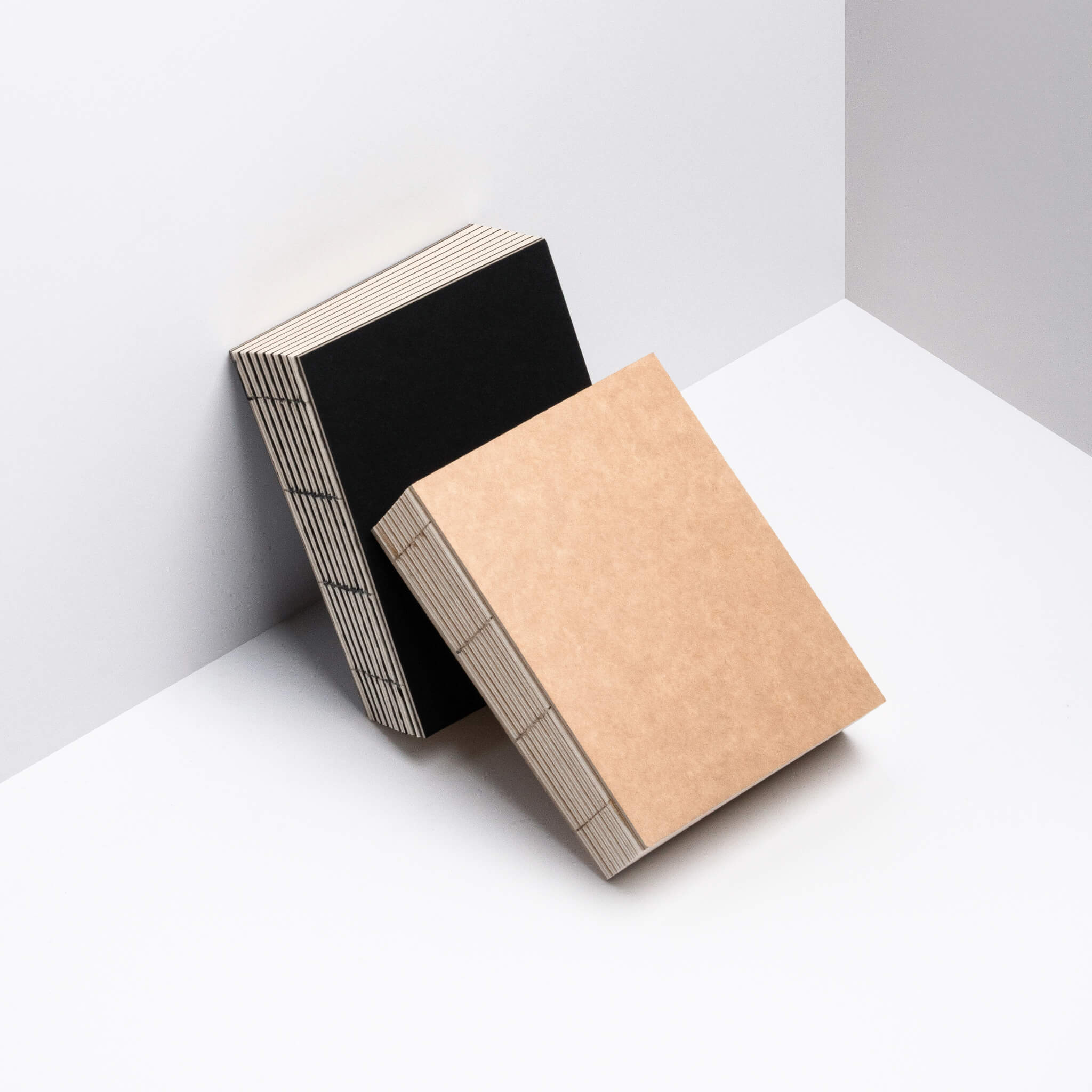 basenotes 1216 Paperbooks in black and kraft covers shown together