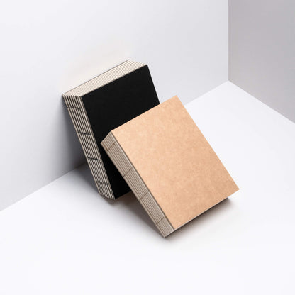 basenotes 1216 Paperbooks in black and kraft covers shown together