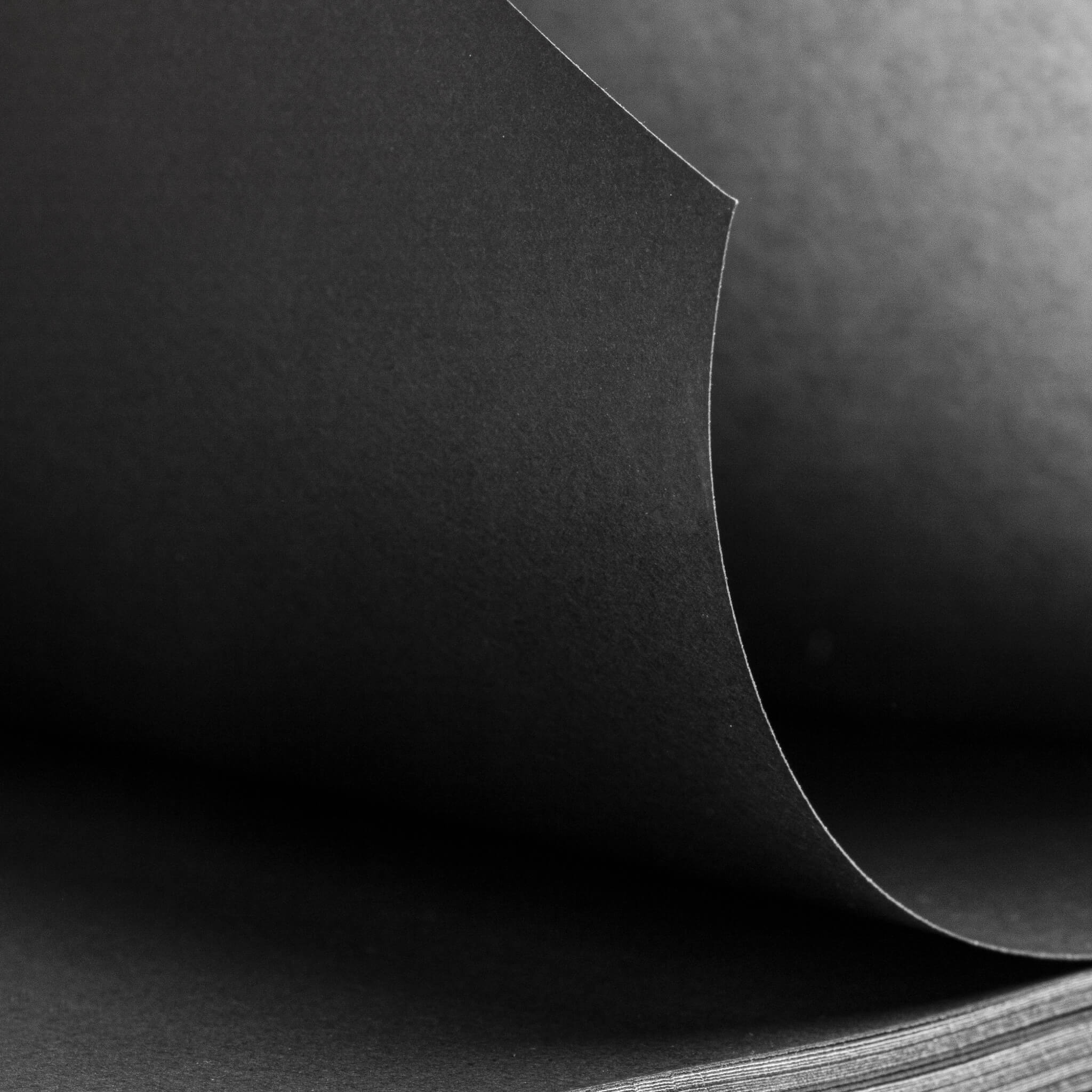 Close-up of the basenotes 1623B Black Paper book showing fine-grain texture of black acid-free pages.