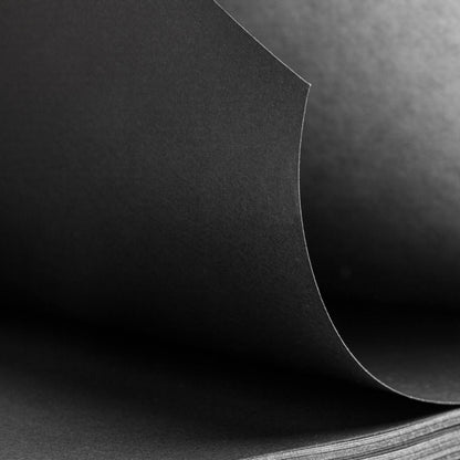 Close-up of the basenotes 1623B Black Paper book showing fine-grain texture of black acid-free pages.