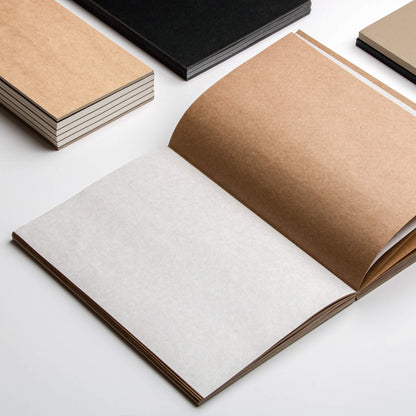 basenotes 1623K Kraft Paper book displayed alongside a black version, both showing exposed spine and thread stitching.