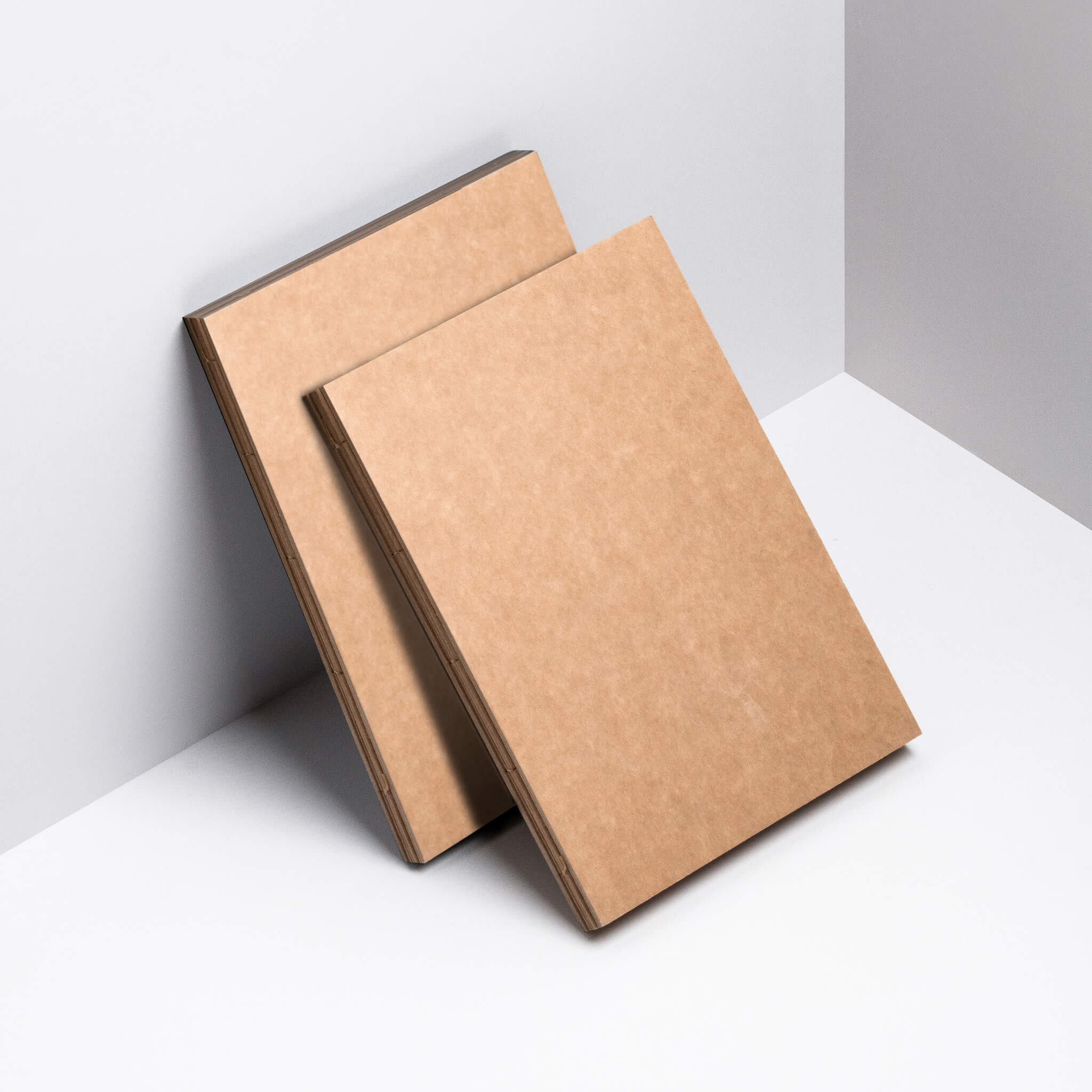 basenotes 1623K Kraft Paper books displayed, both showing exposed spine and thread stitching.