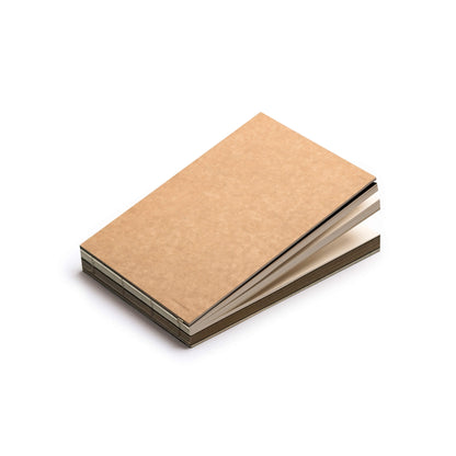 Closed basenotes 2316M Kraft Paper book in landscape format, showing hand-stitched spine and exposed binding.