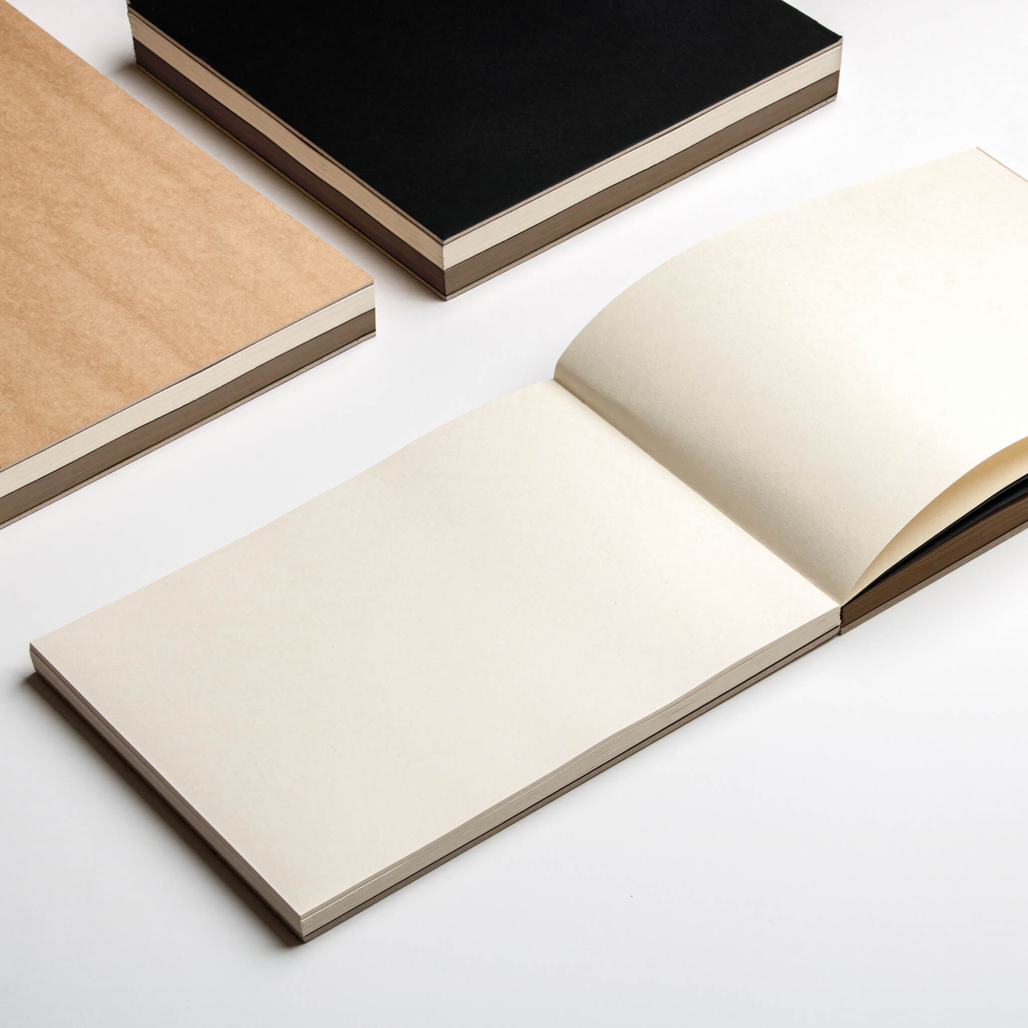 Open basenotes 2316M Paper book showing smooth 127 GSM cream multimedia paper in landscape format.