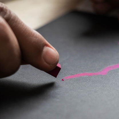 Close-up of pastel drawing on the black paper of the basenotes 2222 Paper book.