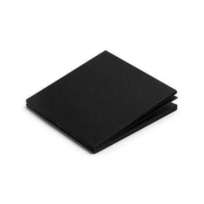 Closed basenotes 2222 Paperbook in black, showing its clean minimalist cover and hand-stitched edge.