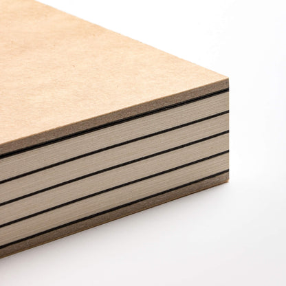 basenotes 2333 Paperbook with kraft cover showing exposed spine and alternating black dividers, crafted with precision binding.