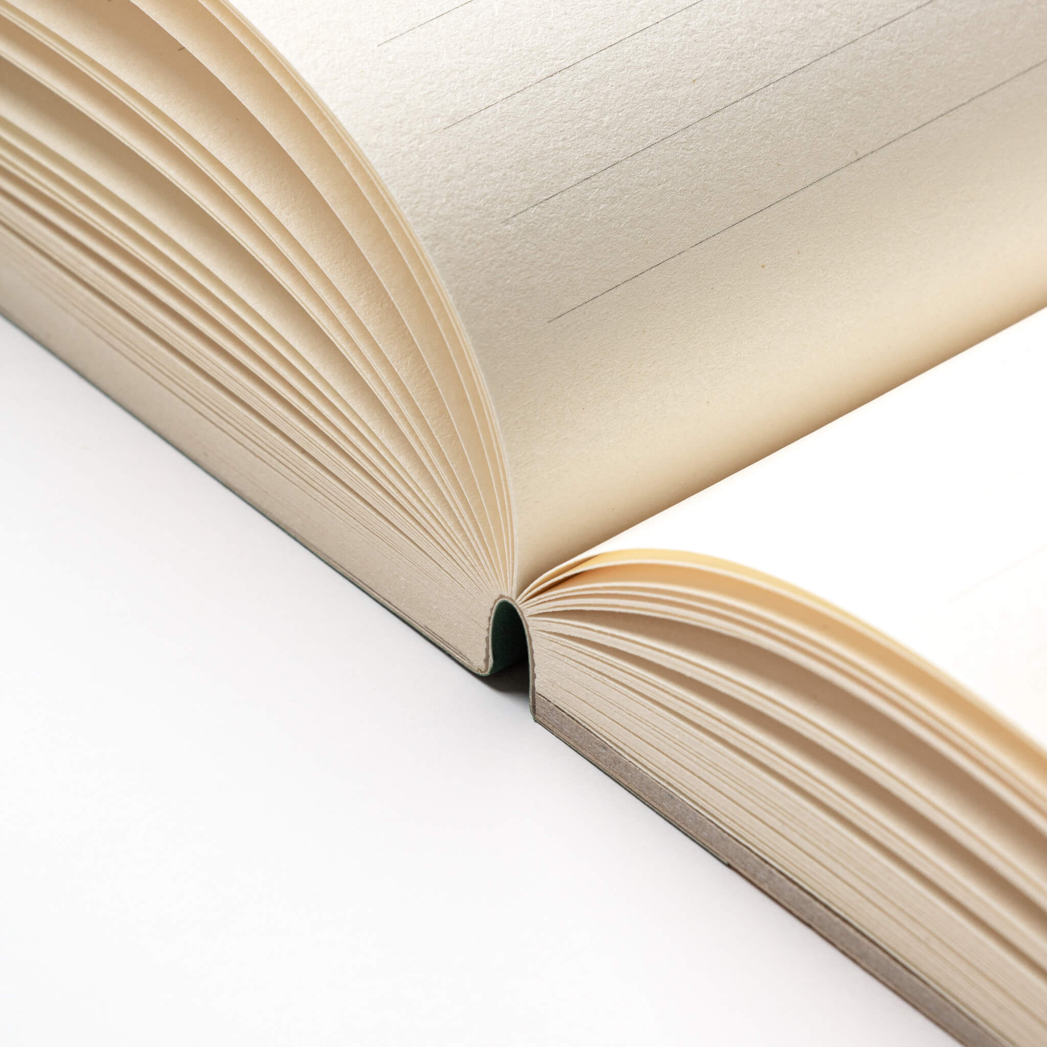 Open basenotes 2721 notebook showing hand-stitched lay-flat binding and clean FSC-certified paper.