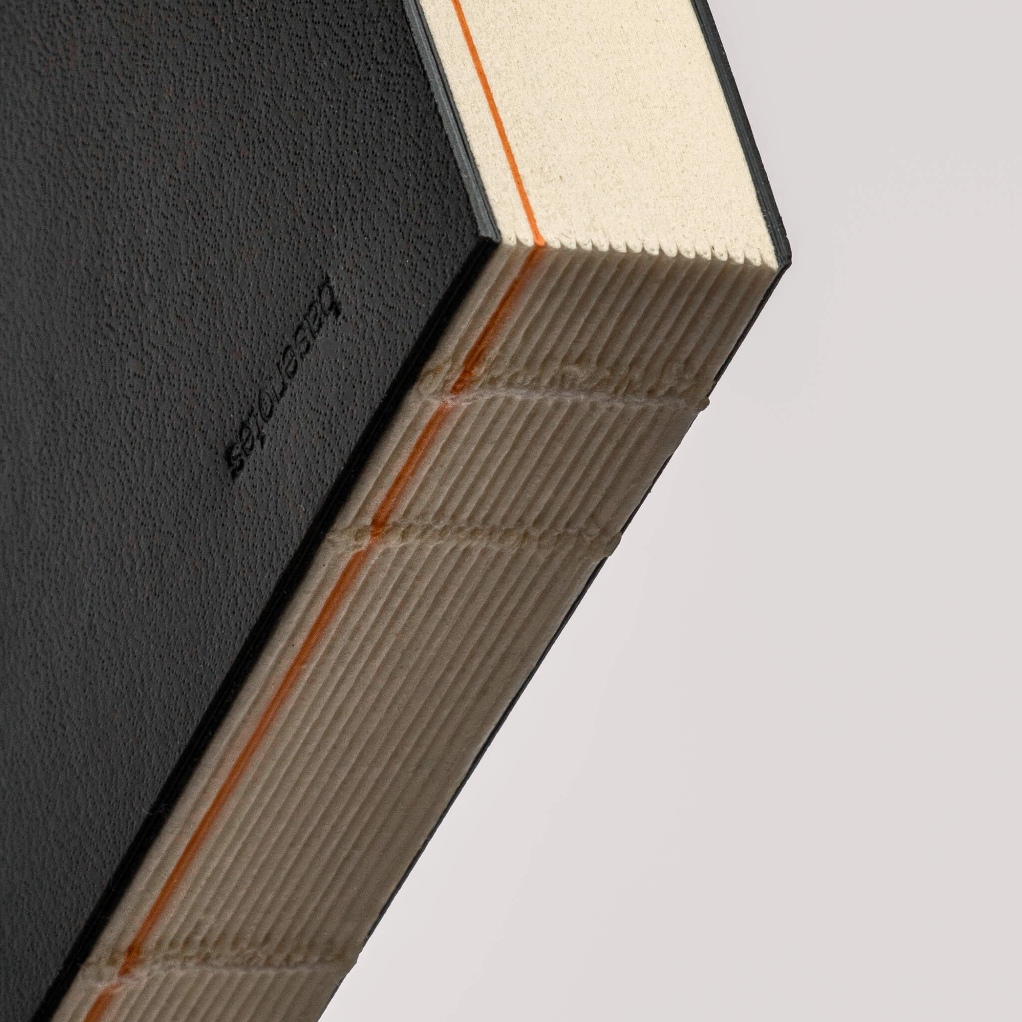 Close-up of the basenotes Planner’s lay-flat hand-sewn binding, highlighting the precise craftsmanship and durable construction.