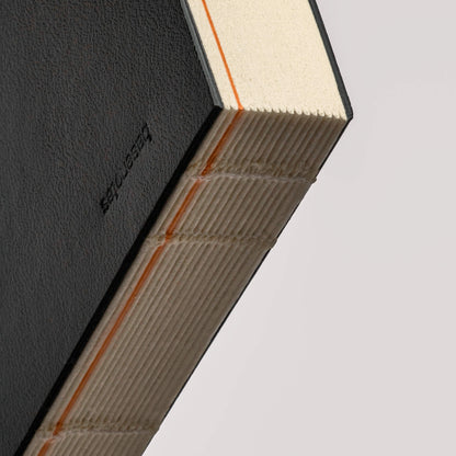 Close-up of the basenotes Planner’s lay-flat hand-sewn binding, highlighting the precise craftsmanship and durable construction.