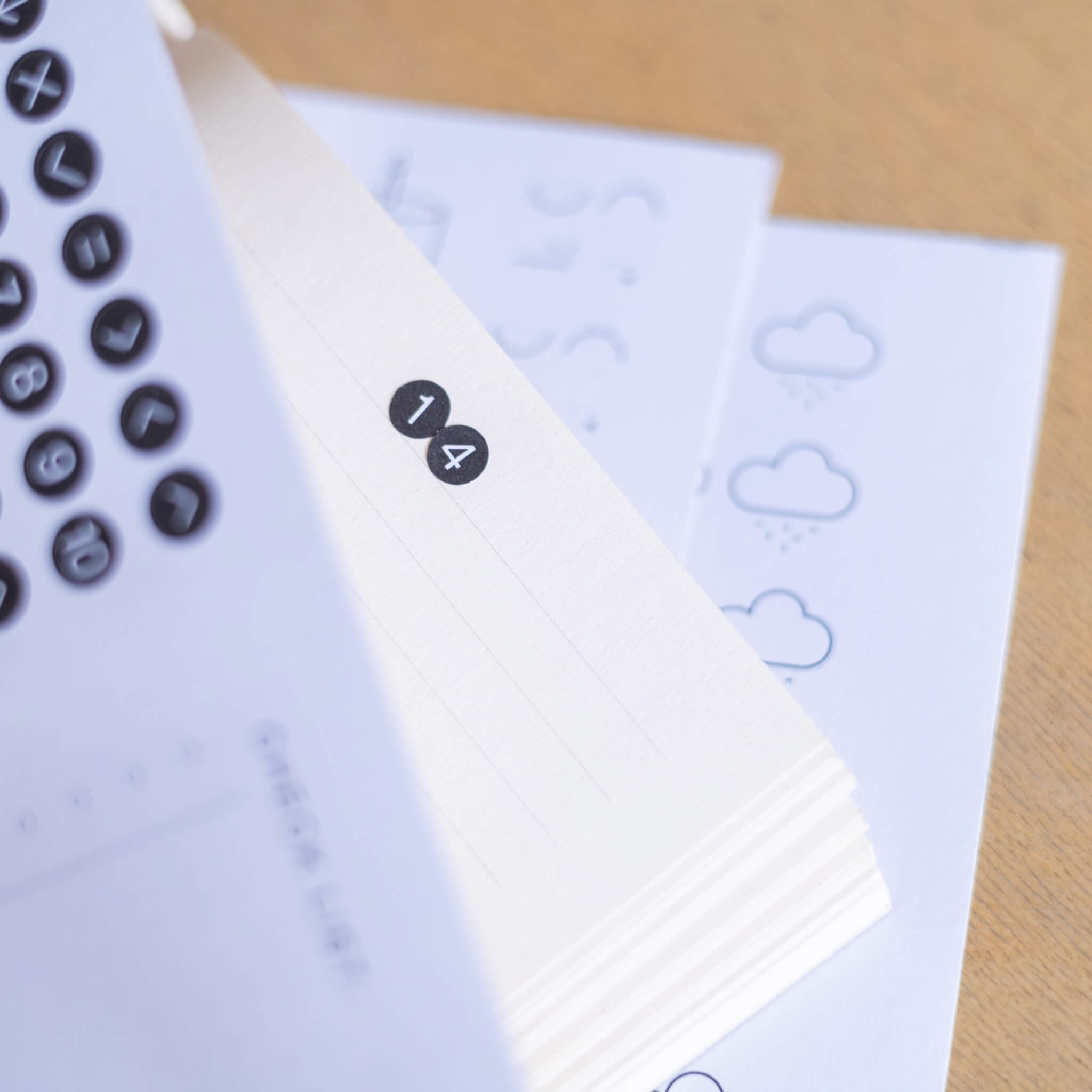 Black number dot stickers placed along the margin of a planner page basenotes