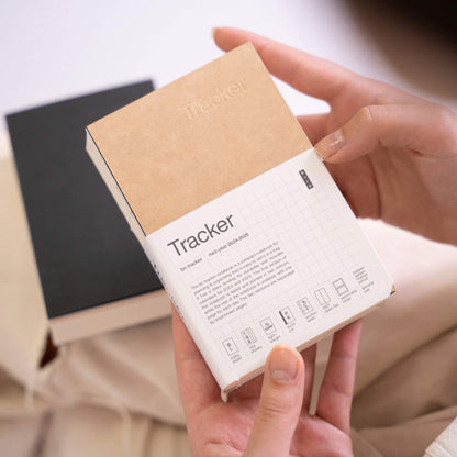 basenotes Tracker Notebook in kraft cover with sleeve packaging, designed for daily planning and progress tracking.