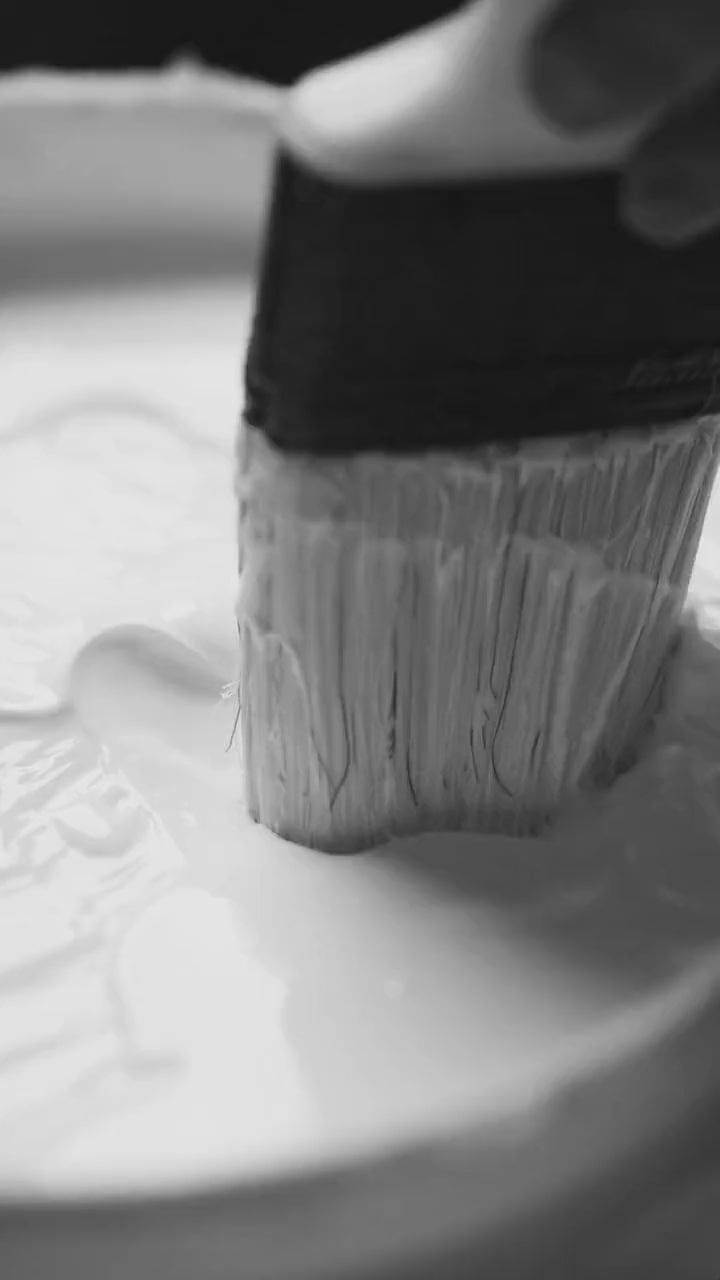 Load video: Video of hand-stitched sketchbook pages being pressed in the basenotes bindery.